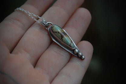 Turquoise dagger pendant